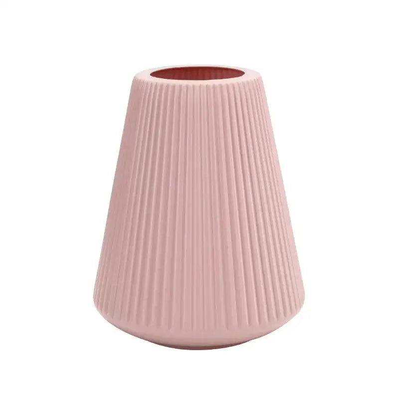 A sleek blush-pink ceramic DecorBites™ modern nordic vase with vertical ribbed texture for home decor