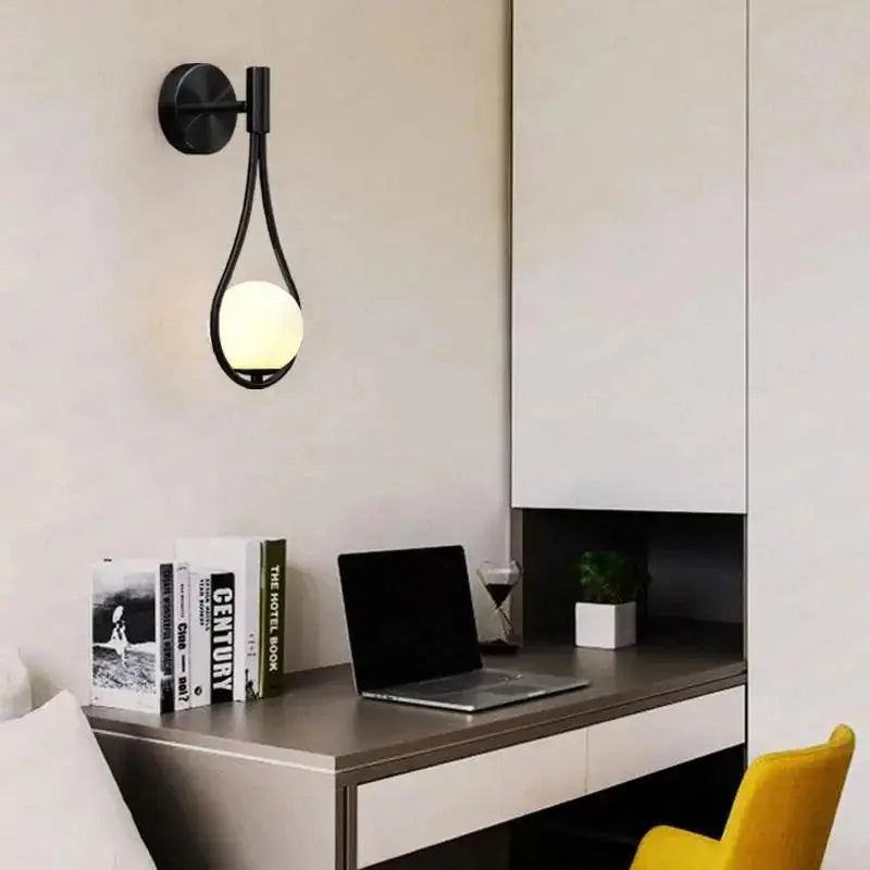 Black metal wall lamp DecorBites modern Nordic livi wall lamp with teardrop frame and glowing spherical bulb