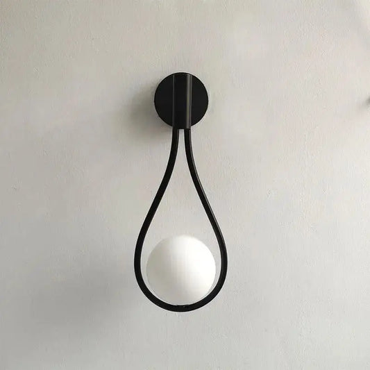 DecorBites™ modern Nordic black wall lamp featuring a minimalist teardrop frame with a frosted spherical bulb