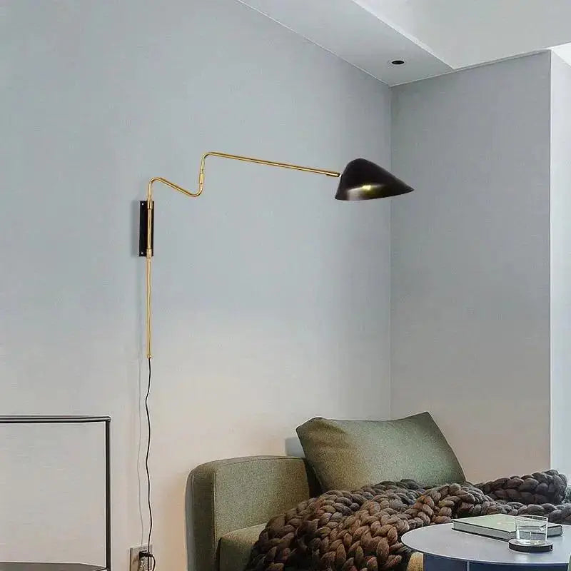 Gold-toned adjustable decorbites modern nordic anneke wall sconce with a black conical shade for stylish lighting