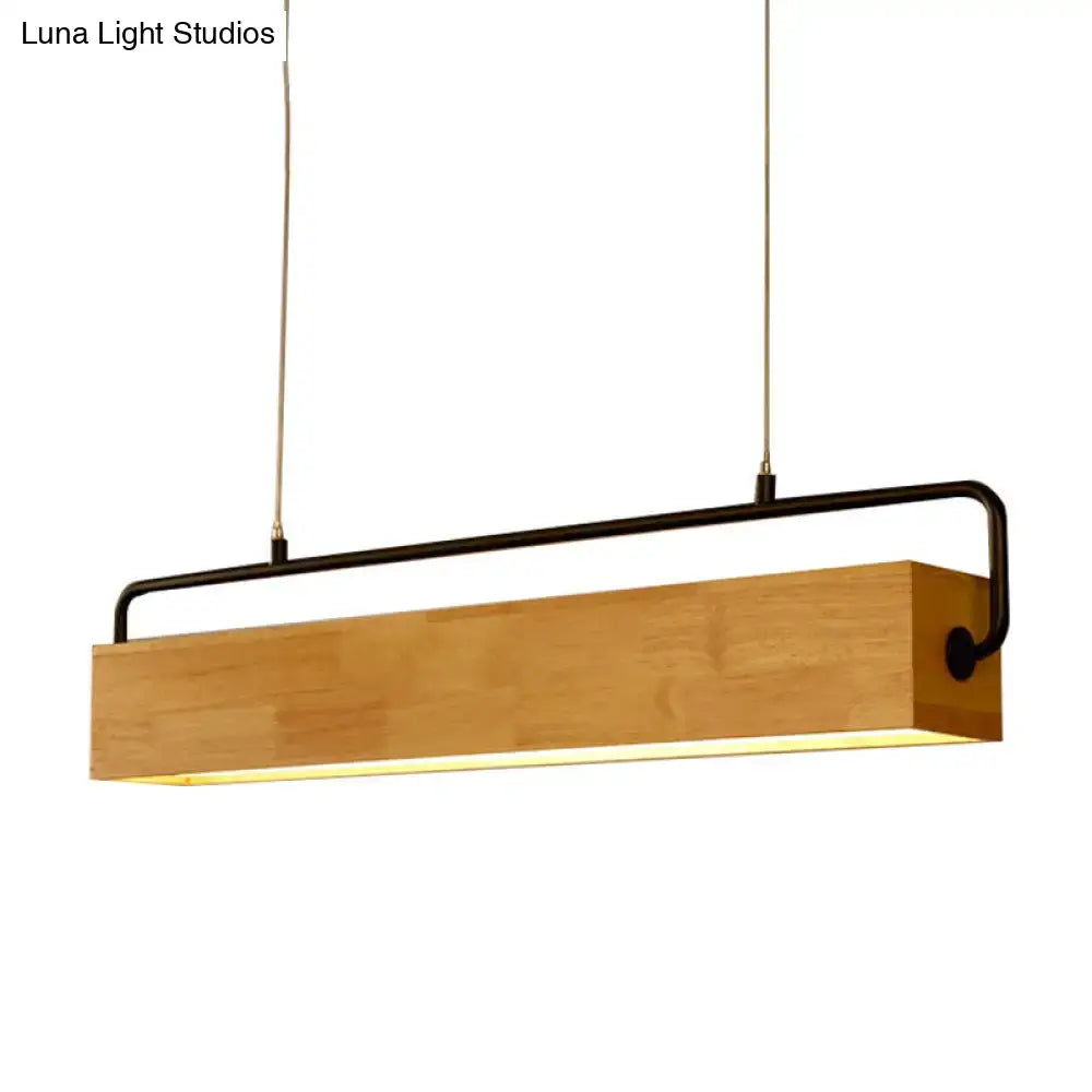 A modern nordic island pendant light with a natural wood body black metal frame and warm glow for 110v-120v 220v-240v use