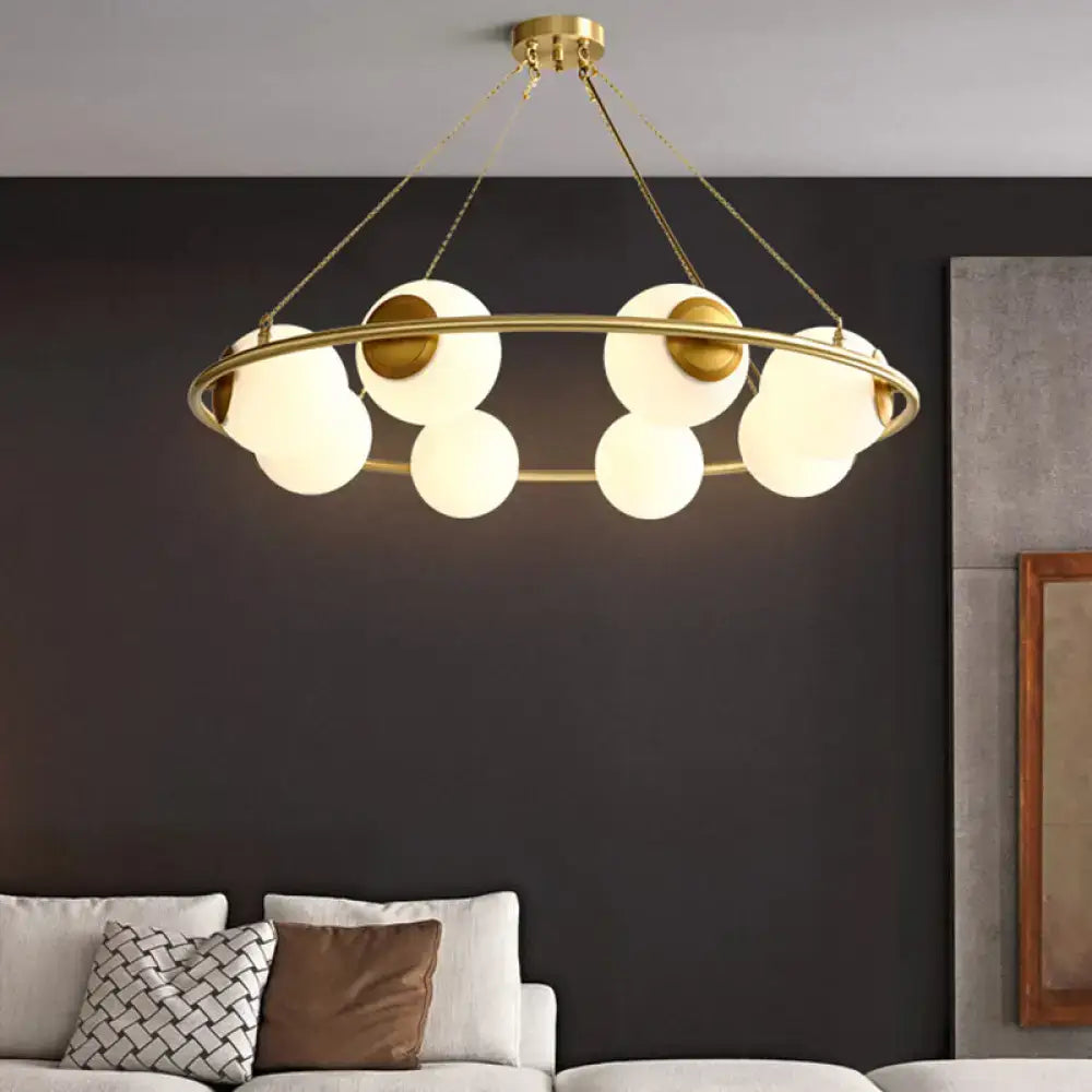 DecorBites modern opal glass ball chandelier featuring gold-toned circular frame with frosted glass spheres lighting fixture