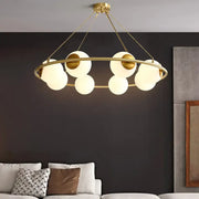DecorBites modern opal glass ball chandelier featuring gold-toned circular frame with frosted glass spheres lighting fixture