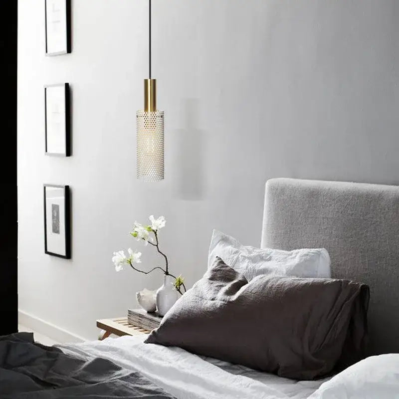 DecorBites modern pendant light with gold-toned cylindrical fixture and perforated translucent glass shade hanging from black cord