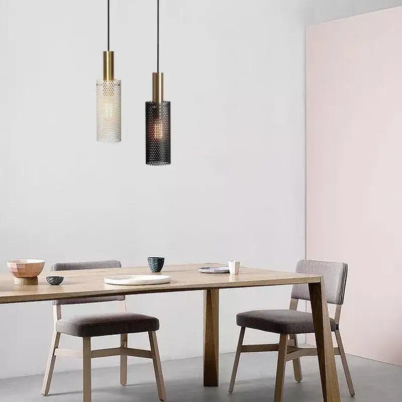 DecorBites™ modern pendant light with brass-finished tops and perforated clear and black glass shades