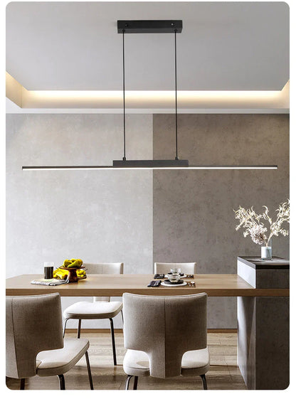 Modern black rectangular pendant light with sleek minimalist design hanging above dining table for dining room use