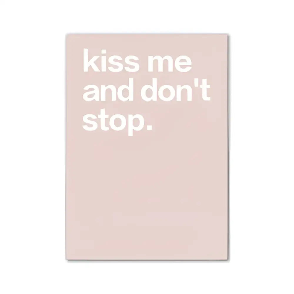A minimalist blush pink wall art canvas by DecorBites™ featuring kiss me and dont stop text for modern room decor