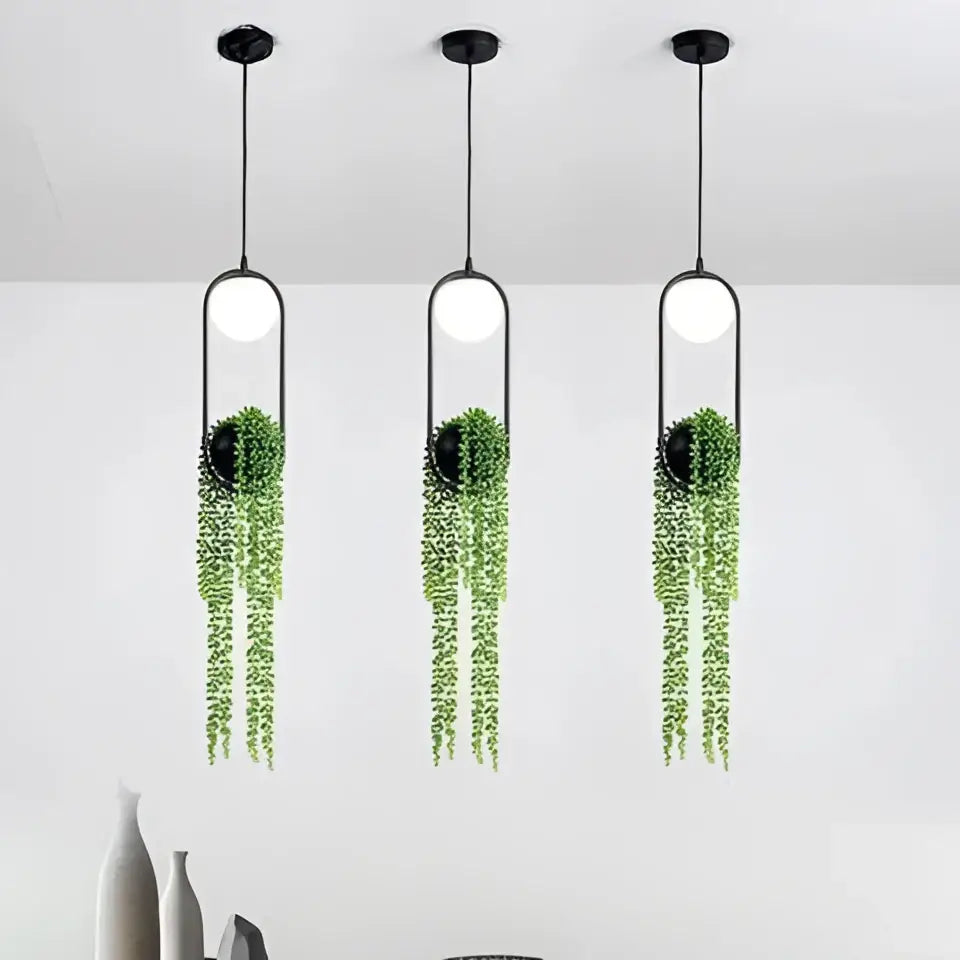 DecorBites™ modern planter pendant lighting with three black pendant lights featuring white bulbs and green vines