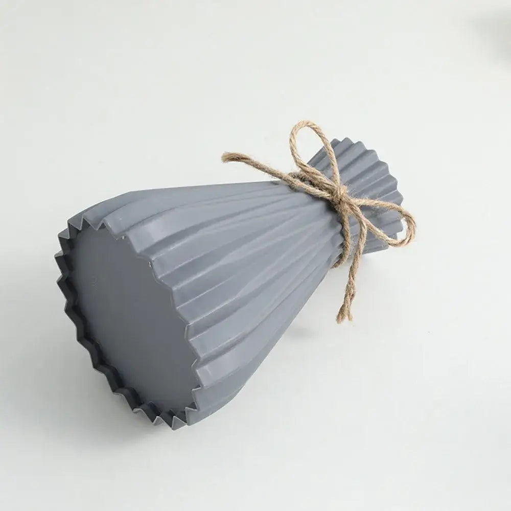 Gray ribbed ceramic flower vase tied with natural twine from DecorBites™ for modern simple dry flowers display