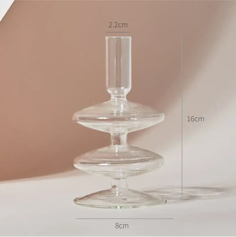Clear glass candle holder with tiered disc-shaped layers and slender stem in decorbites™ modern transparent glass vases set