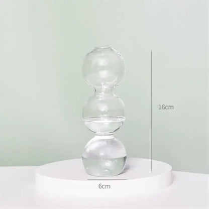 Clear glass vase from decorbites™ with three stacked spherical water-filled sections to decorate root spaces