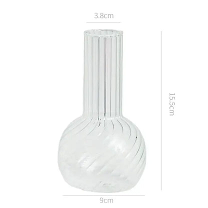 Decorbites modern transparent glass vase with vertical ridges and swirling patterns to decorate root spaces width 750px height