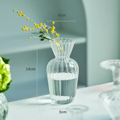 Decorbites™ modern transparent glass vase with vertical ridges and fluted rim holding yellow flowers for home decor
