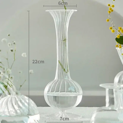 DecorBites™ modern transparent glass vase with vertical ridges and flared top to decorate root stems