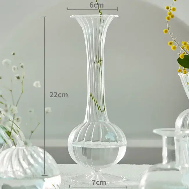 DecorBites™ modern transparent glass vase with vertical ridges and flared top to decorate root stems