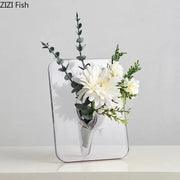 Decorbites™ modern transparent square vase is a clear rectangular wall-mounted square vase holding white flowers and greenery