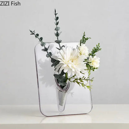 Decorbites™ modern transparent square vase is a clear rectangular wall-mounted square vase holding white flowers and greenery