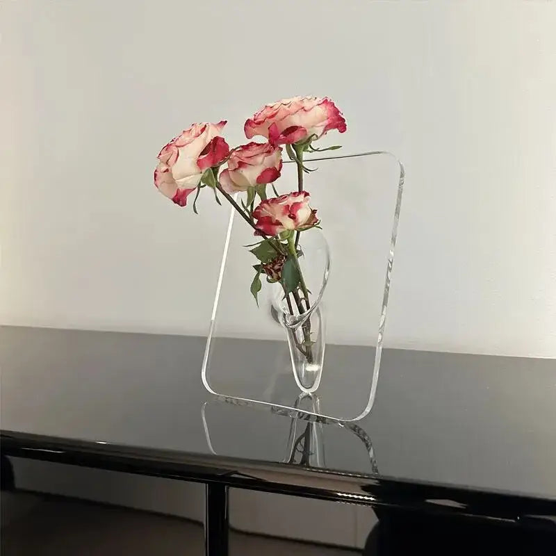 DecorBites modern transparent square vase with a sleek acrylic frame holds delicate pink and white roses