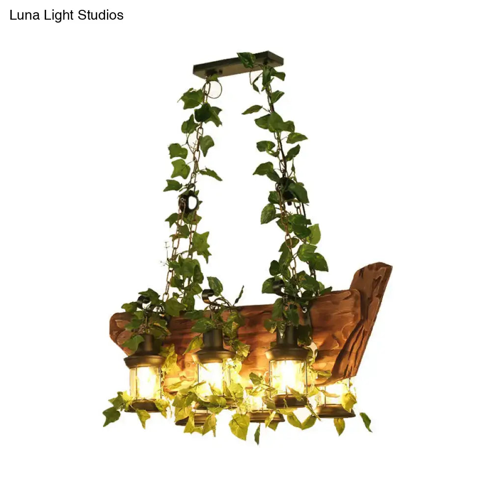 Rustic wooden pendant light with three lantern-style e26 e27 bulbs and green ivy vines in industrial style design