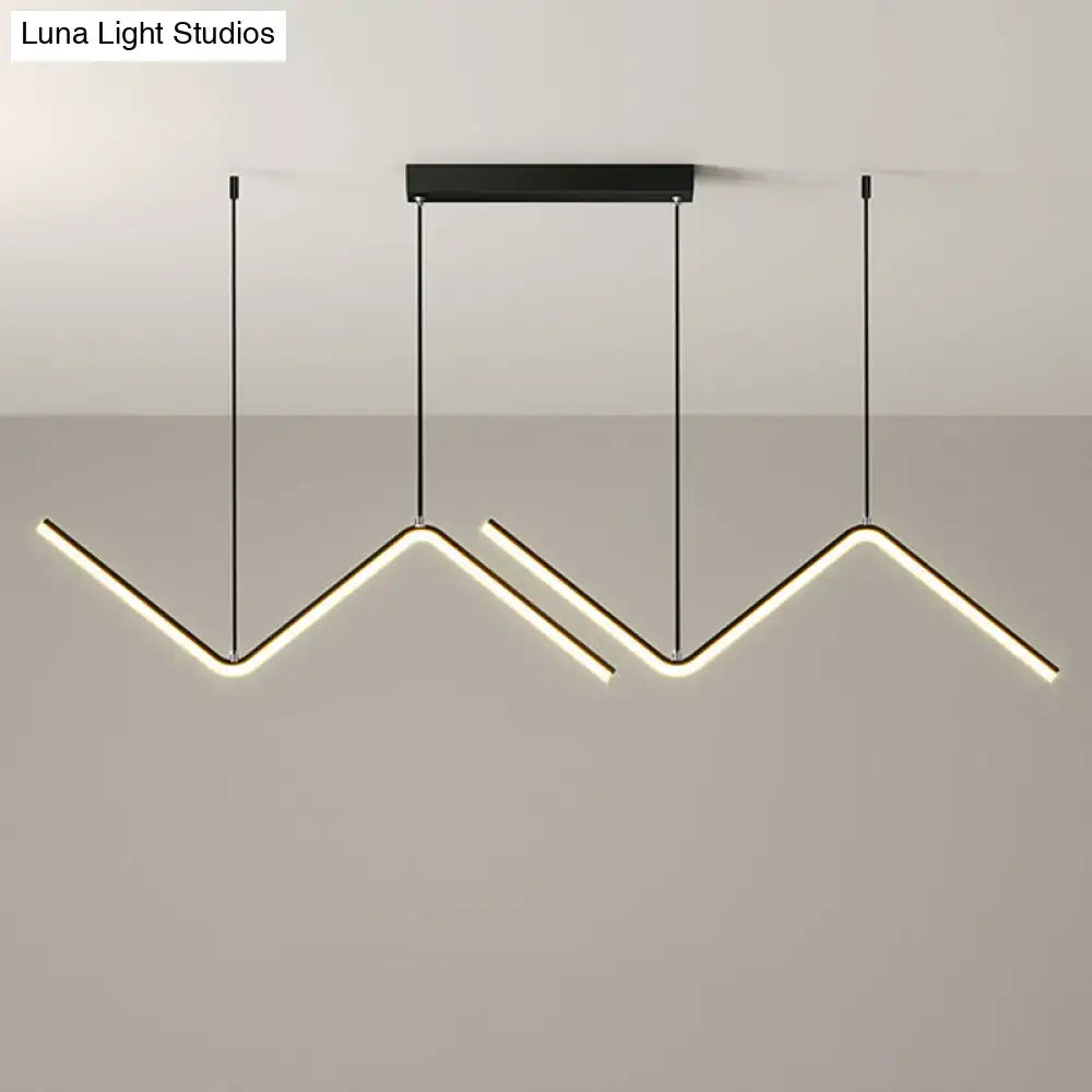 Modern black metal hanging lamp with three angular led arms emitting warm white light for dining room lighting