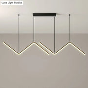Modern black metal hanging lamp with three angular led arms emitting warm white light for dining room lighting