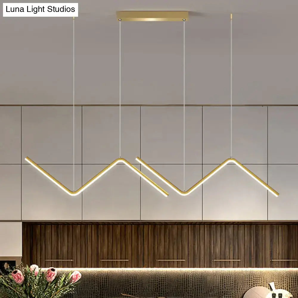Modern gold-toned metal hanging lamp with zigzag design and rectangular ceiling mount for dining room lighting