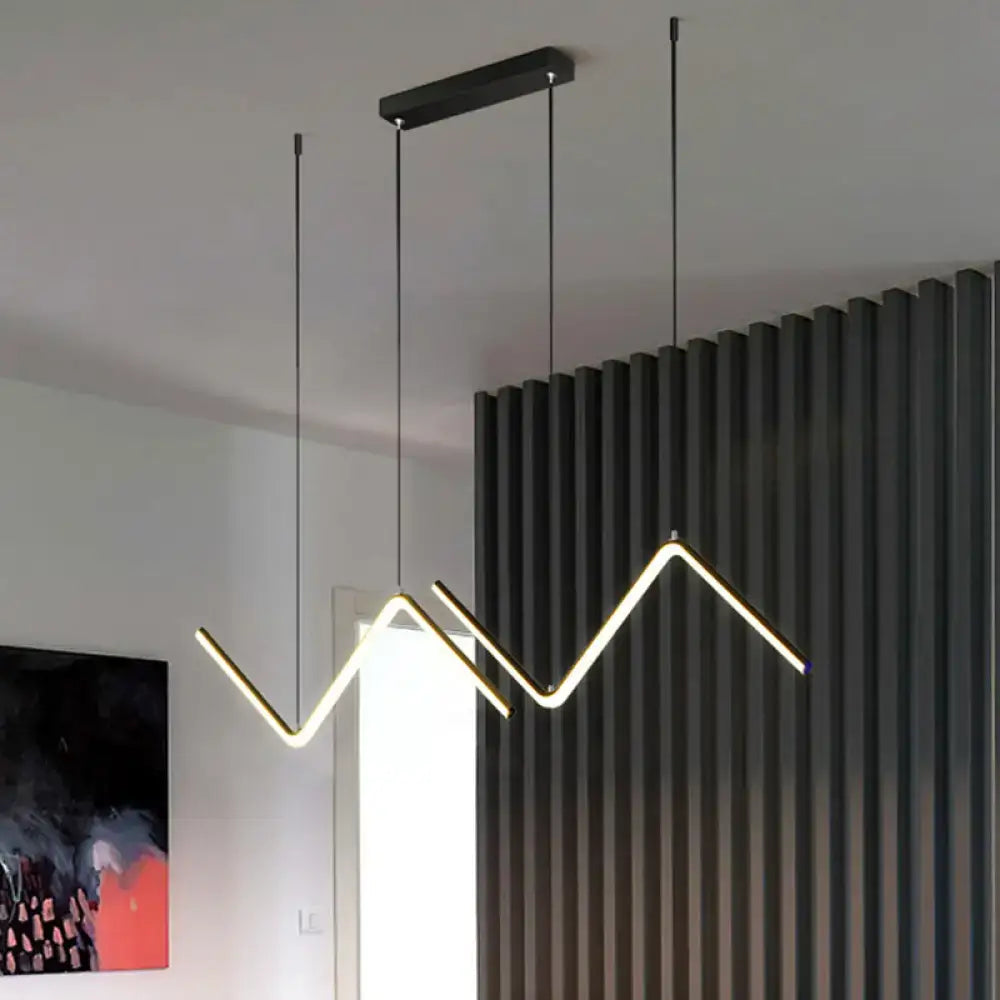 Modern black metal hanging lamp with sleek zigzag led design and warm white light for dining room by DecorBites