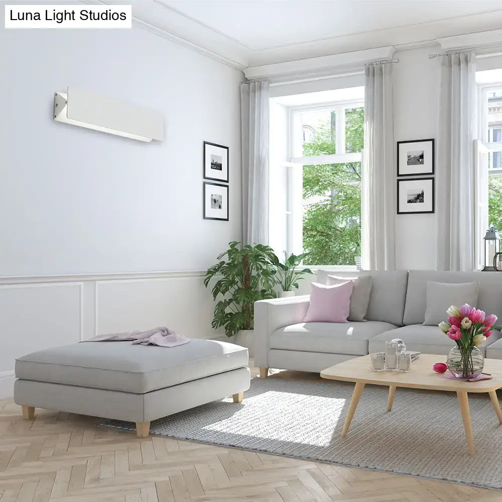 Modern white rectangular wall light with sleek design offers direct wired electric installation for outdoor use