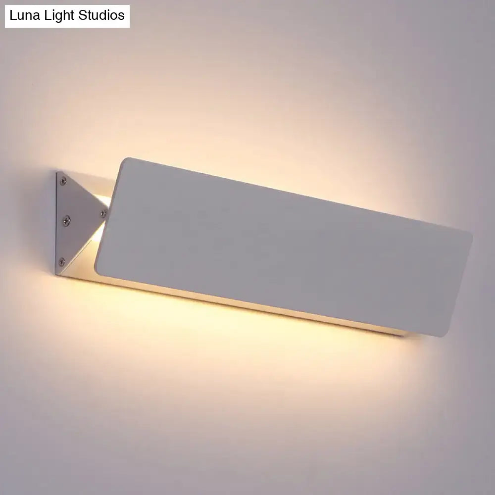 Modern white rectangular wall light with sleek minimalist design and warm ambient lighting direct wired electric
