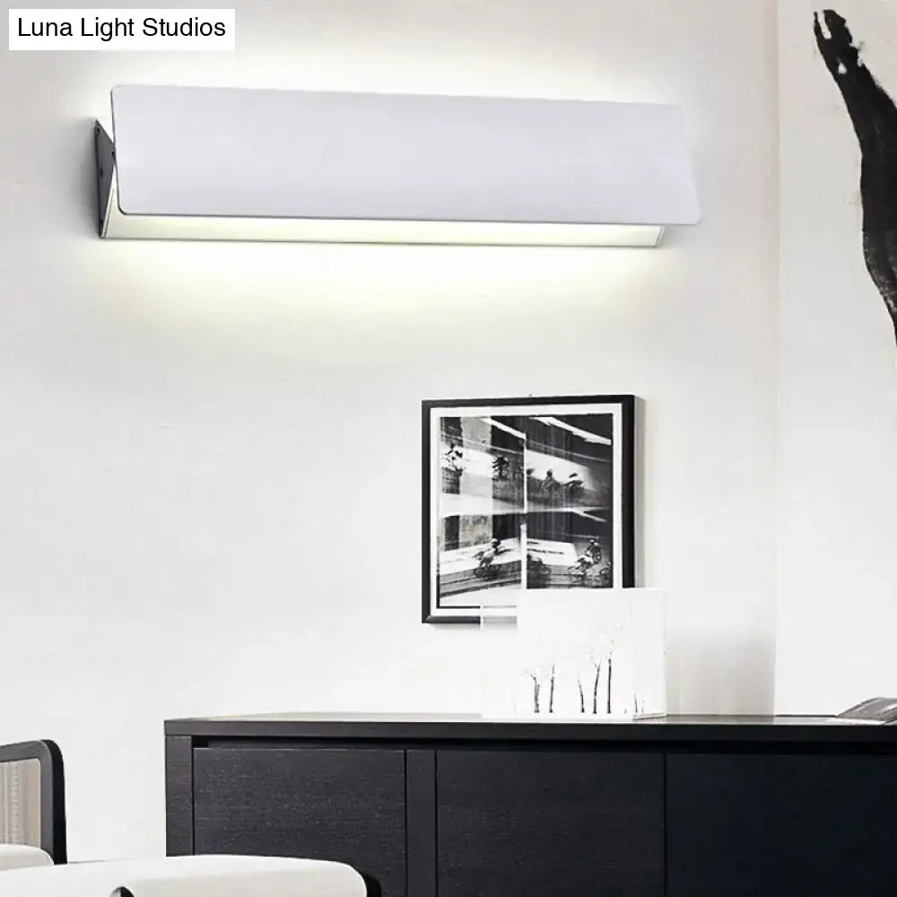 Modern white rectangular wall light offers sleek minimalist design with direct wired electric installation for outdoor use