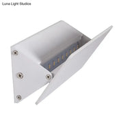 Modern white rectangular outdoor wall light with visible internal leds offers sleek direct wired electric installation