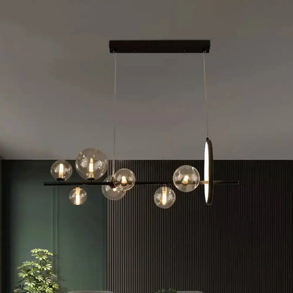 DecorBites™ modernist black metal island light with seven clear glass globe bulbs and circular hanging pendant design
