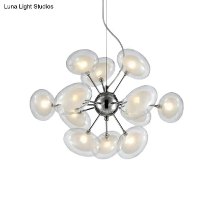 Modern chrome DecorBites™ 12-light chandelier featuring dual oblate glass globe shades radiating from a central hub