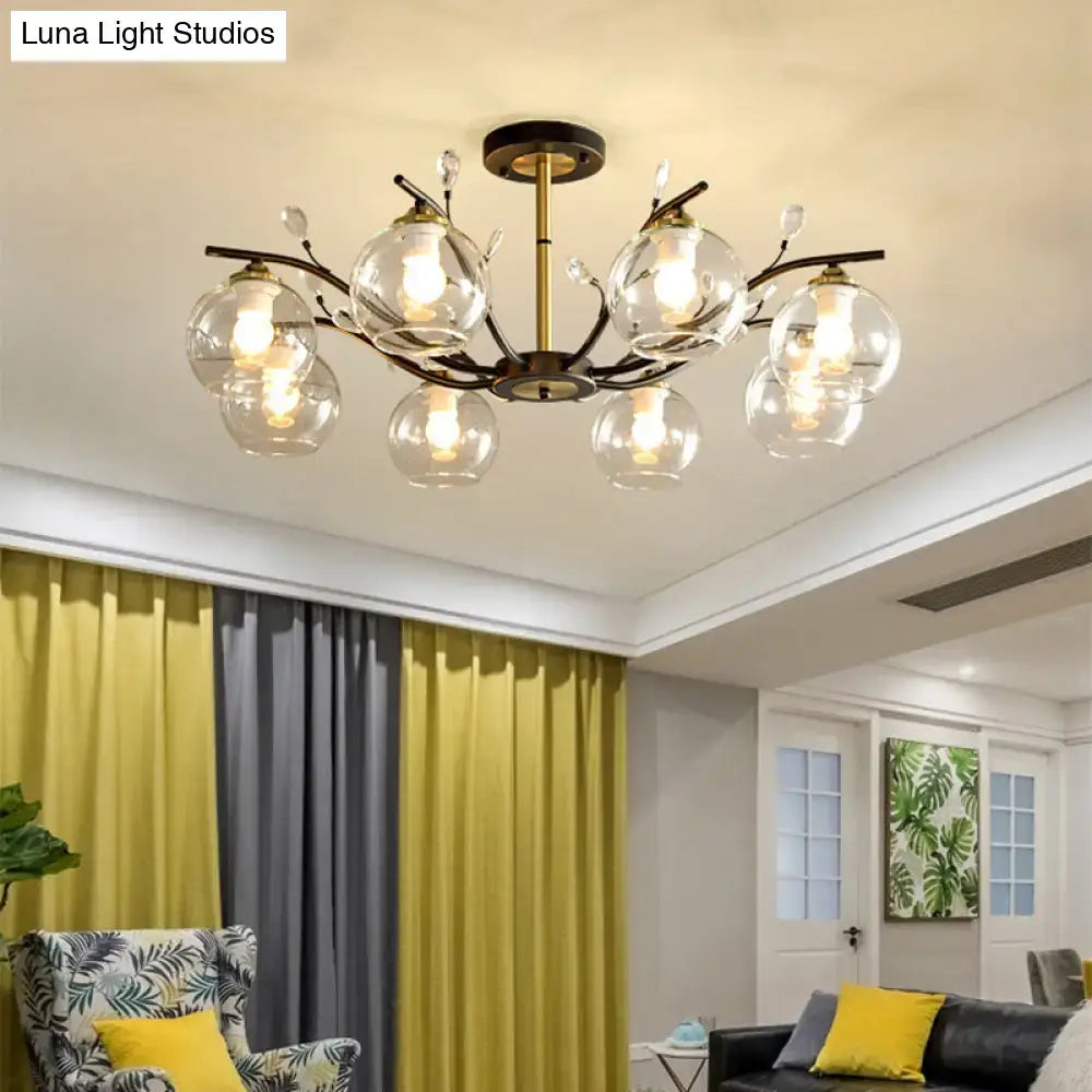 Antique brass branch-style ceiling light with cream clear glass globe shades and crystal accents for modern decor