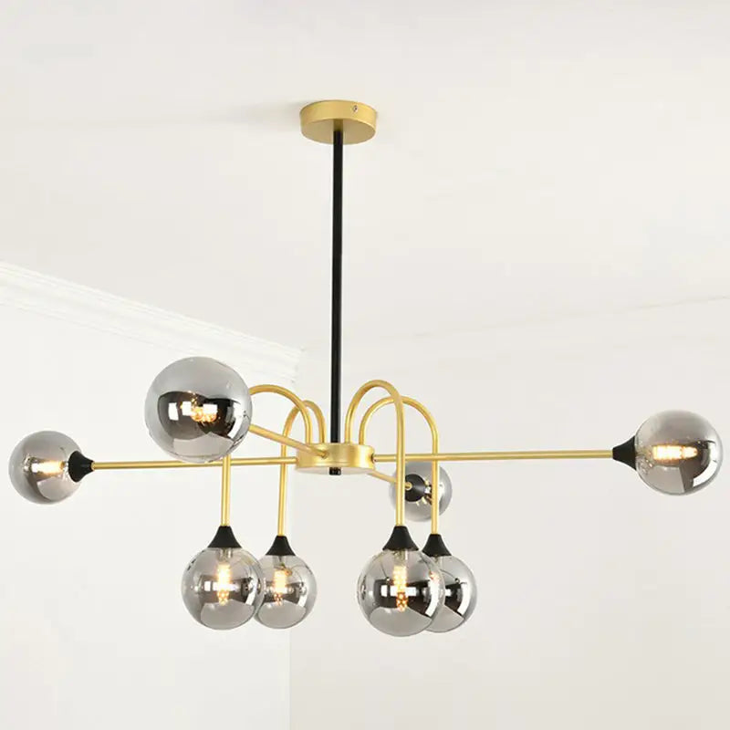 Modern gold-toned decorbites modo glass suspension light with six clear glass bulbs and black rod for dining room