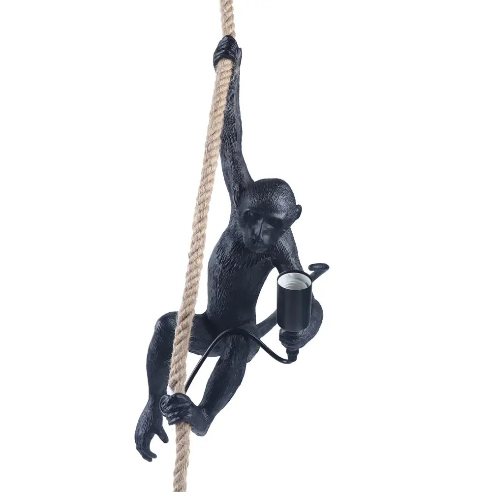 Black resin monkey decoration hanging from hemp rope holding e27 bulb holder in decorbites rope chandelier pendant light
