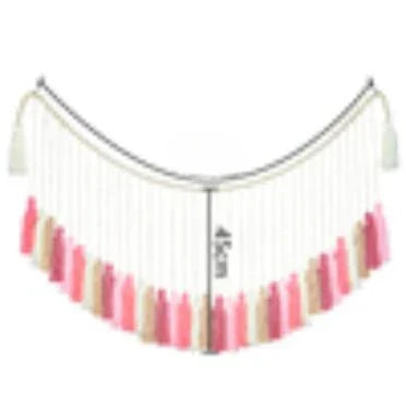A delicate moroccan bohemian wall decor tapestry featuring a curved fringe scarf with cascading tassels in soft pink and beige