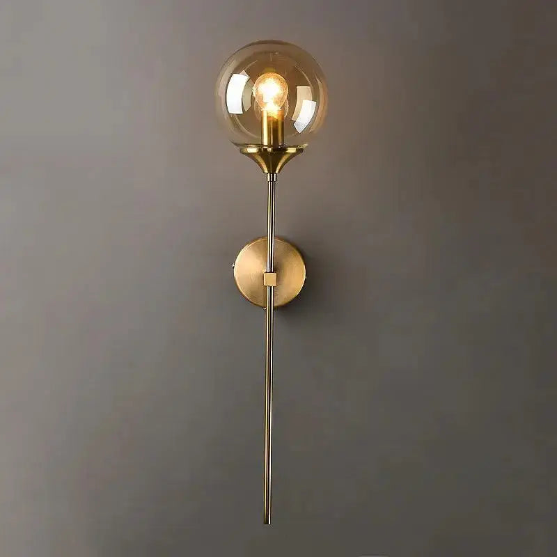 DecorBites Moroccan glass wall sconce featuring a sleek brass design with an amber glass wall globe and filament bulb