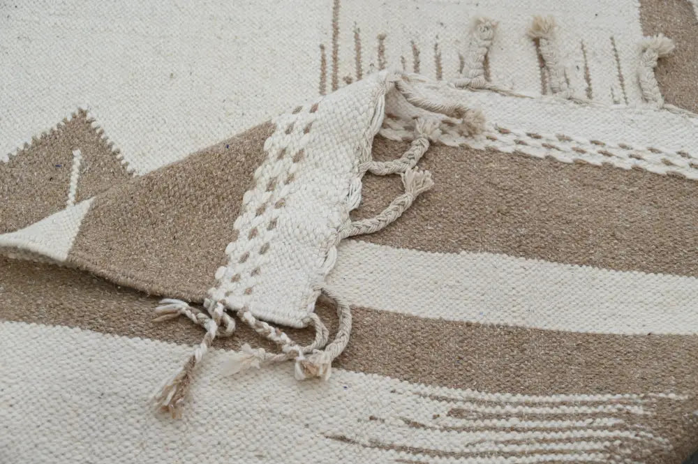 Beige and cream geometric woven moroccan handmade azilal rug with fringed edges by decorbites 300x200cm