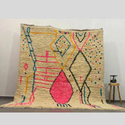 Beige moroccan handmade azilal rug with vibrant pink yellow blue and black geometric patterns 3m x 2.5m by decorbites