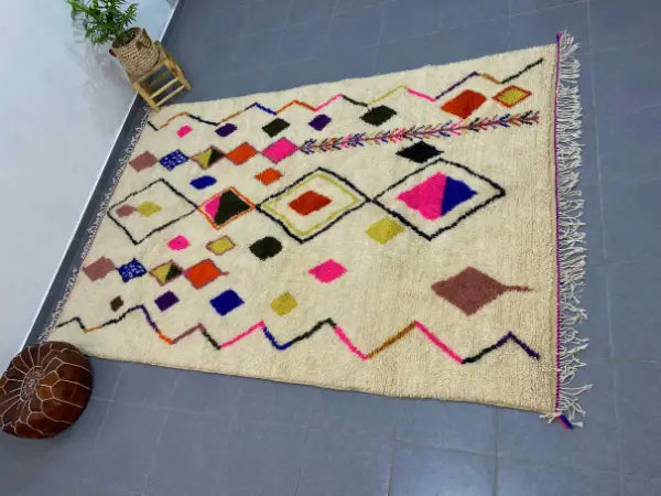 Cream-colored decorbites™ moroccan handmade azilal rug 3m x 2m with vibrant geometric patterns on wool base