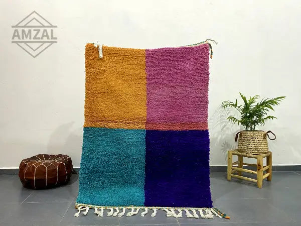 Vibrant moroccan handmade beni ouarain rug with plush wool in mustard yellow magenta teal and deep purple featuring fringe detailing