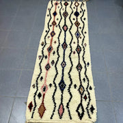 Cream-colored moroccan handmade beni ouarain rug with intricate black pink and navy geometric patterns 2.5m x 0.7m