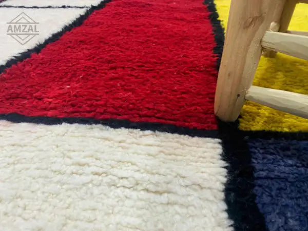 Decorbites™ moroccan handmade beni ouarain rug featuring bold red white yellow and navy geometric sections with black borders
