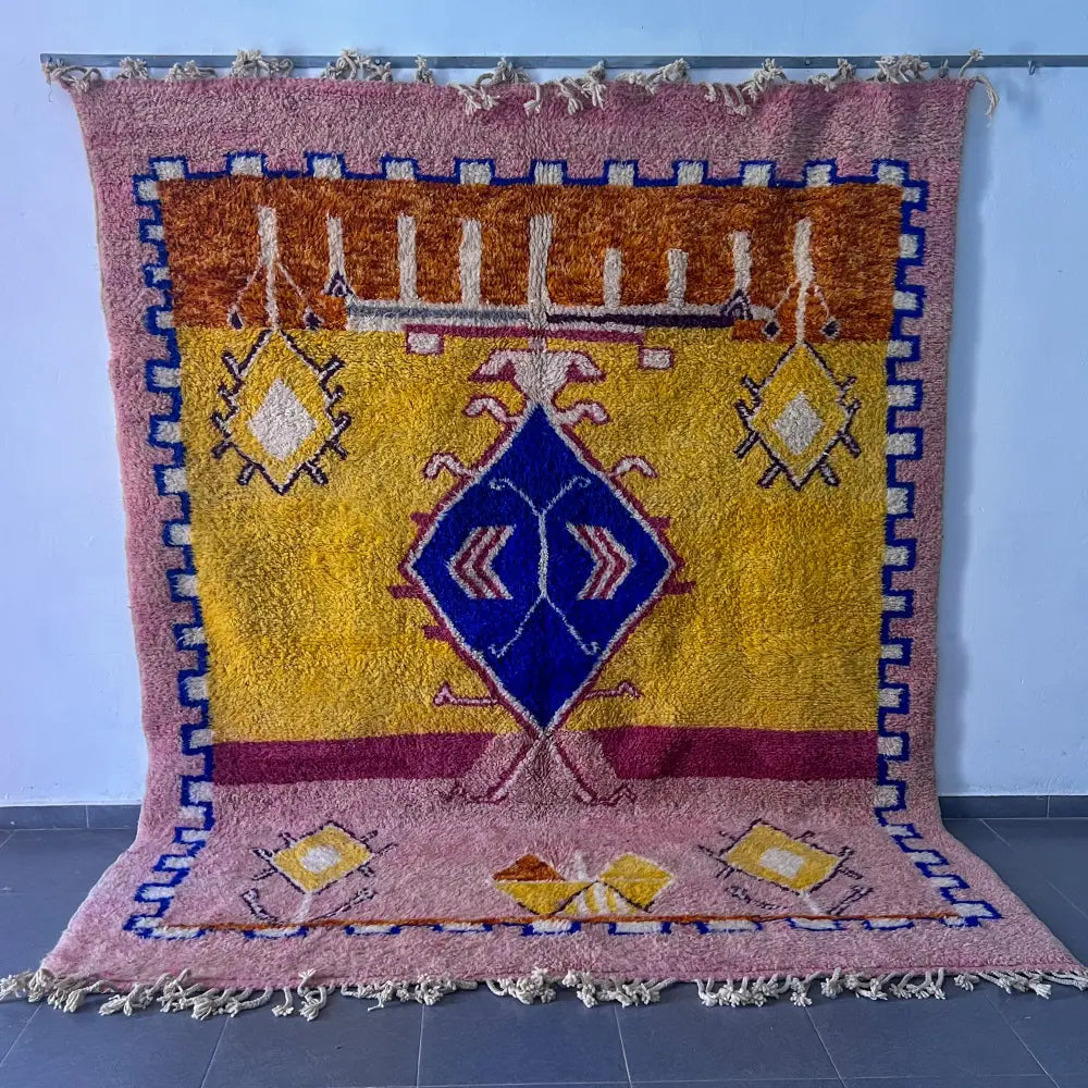 Vibrant decorbites moroccan handmade beni ouarain rug with plush texture and bold mustard yellow blue dusty rose patterns