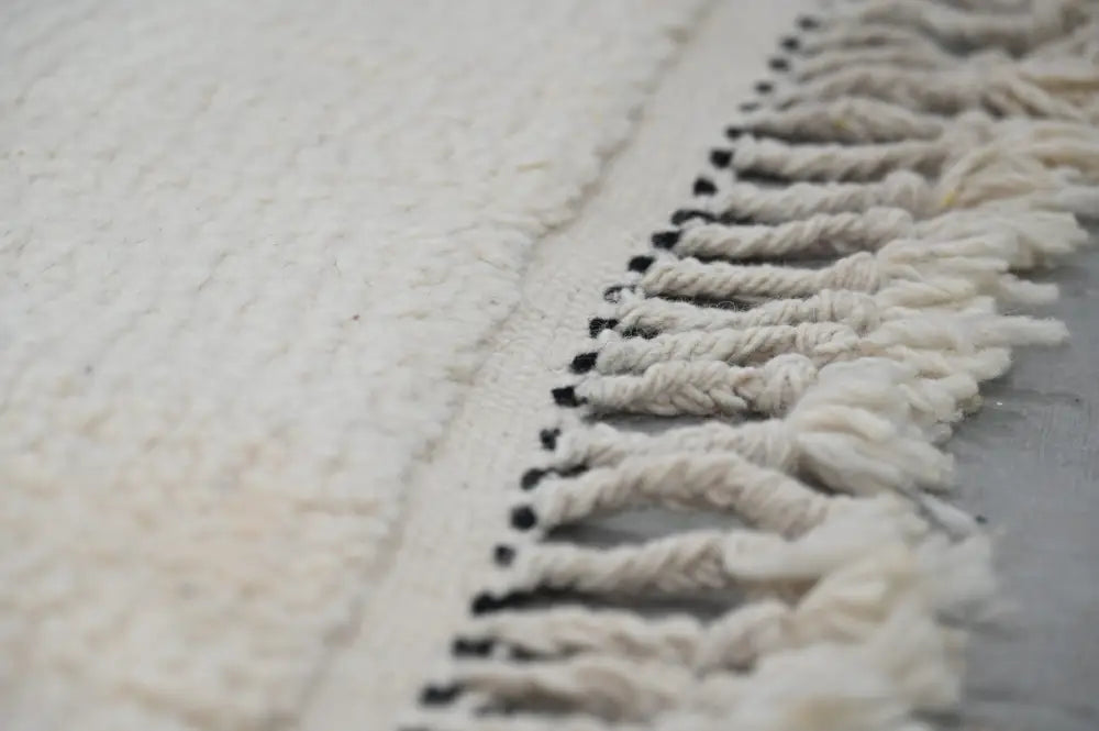 White textured moroccan handmade traditional azilal rug with fringe of twisted yarns tipped in black 224 x 152 cm