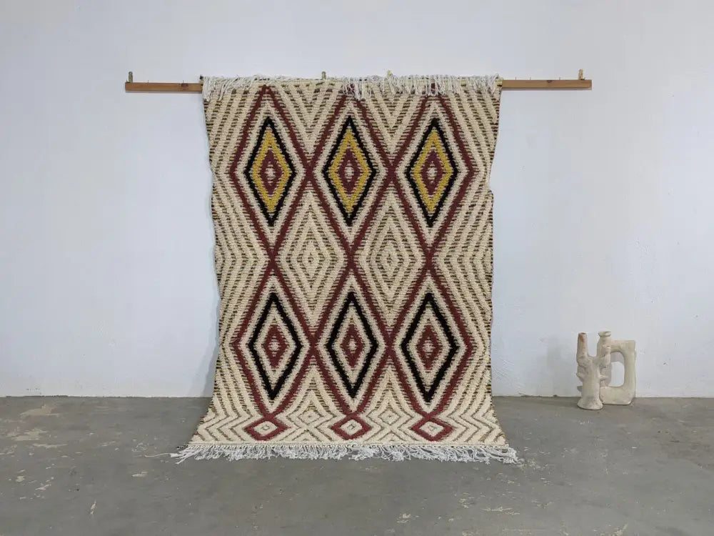Beige maroon and black geometric-patterned decorated bites moroccan handmade traditional azilal rug with fringed edges