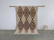 Beige maroon and black geometric-patterned decorated bites moroccan handmade traditional azilal rug with fringed edges