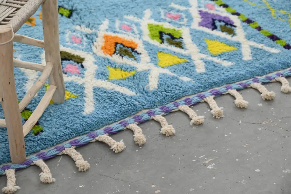 Vibrant blue moroccan handmade traditional azilal rug with geometric pattern and tassels by decorbites 236 x 160 cm