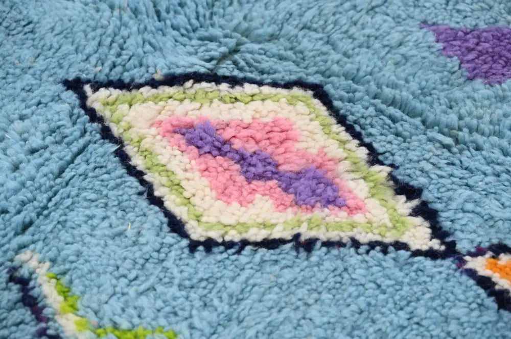 DecorBites™ moroccan handmade traditional azilal rug in light blue with pink purple diamond pattern and cream green borders